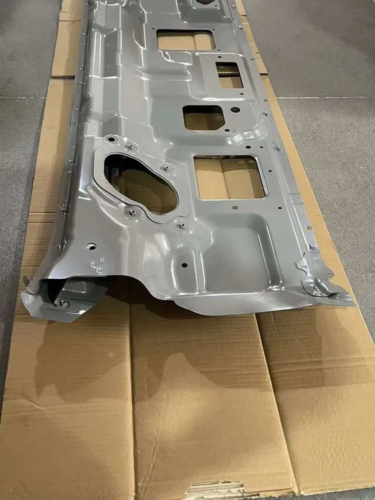 Gray Plastic / Metal Front Panel / Garnish for Isuzu New Elf 2023
