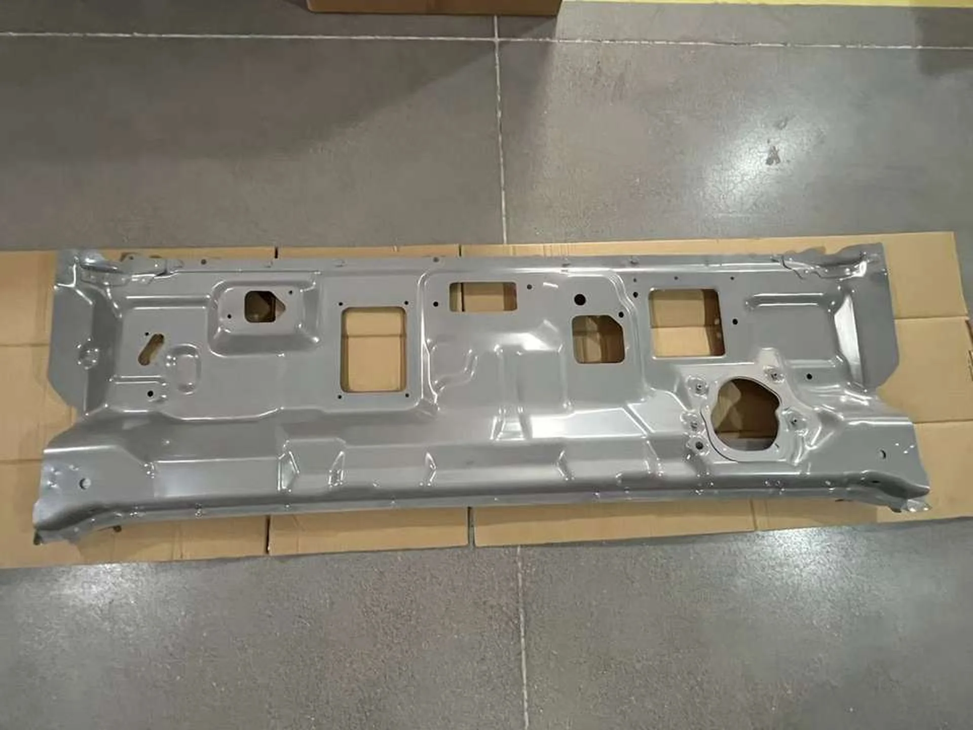 Gray Plastic / Metal Front Panel / Garnish for Isuzu New Elf 2023